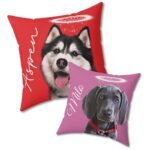 Two red and light pink custom pet remembrance pillows with pet portrait and halo ring, close-up view