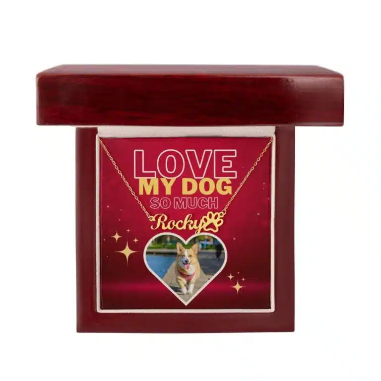 Gold-finish dog name and paw print necklace with dog photo, set against a red background, elegantly displayed in a luxury gift box