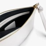 Open custom clutch bag showing the interior compartments – includes pocket and zipper, ideal for storing essentials with a personalized touch